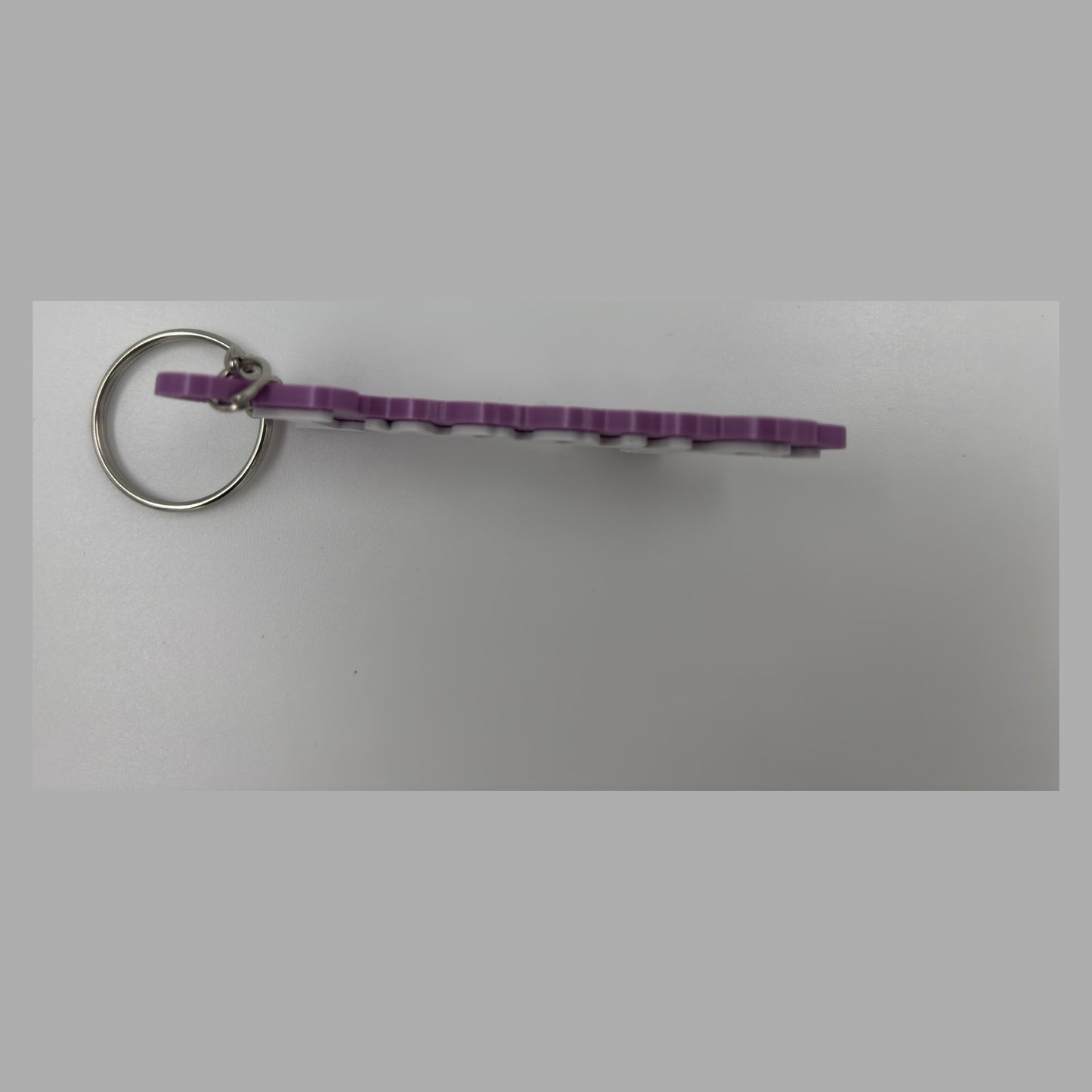 Cursive name keychain — photograph of the printed piece