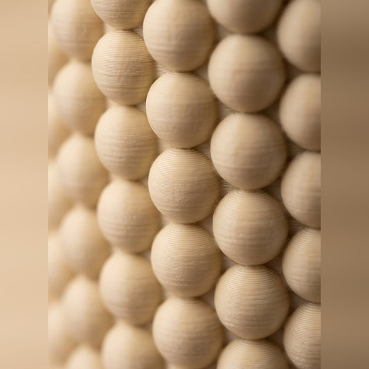 Close-up of the beaded bobble texture wrapping the pen pot