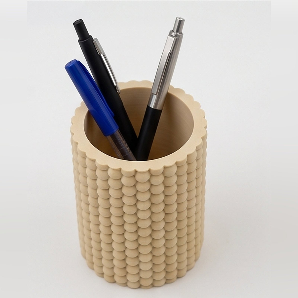 Bobble pen pot seen from above, showing the smooth interior and scalloped rim