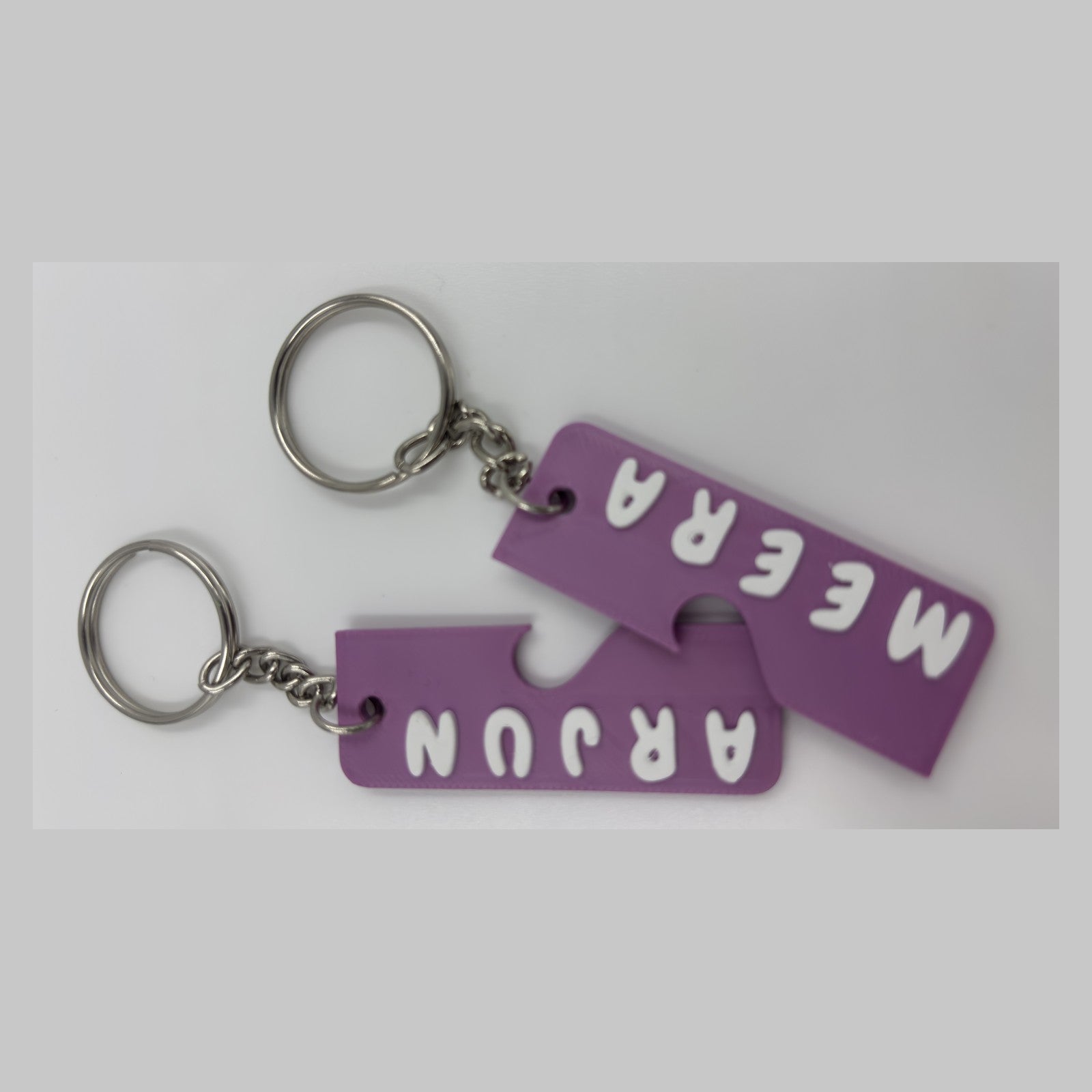 Pair of interlocking heart name keychains — photograph of the printed piece