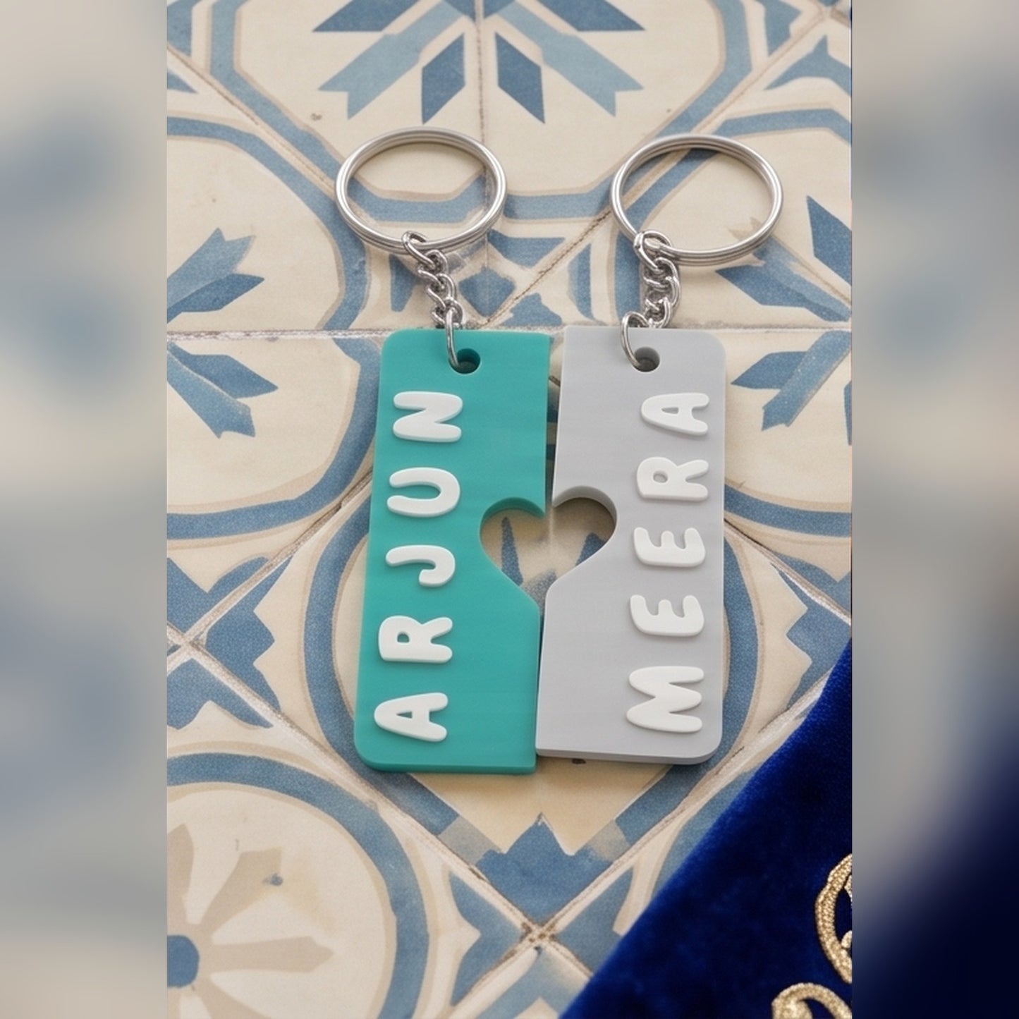 Pair of interlocking heart name keychains — styled view 3