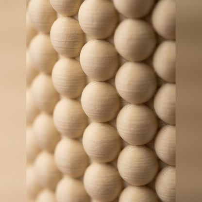 Close-up of the beaded bobble texture wrapping the pen pot