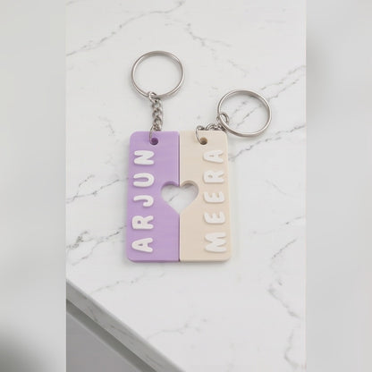 Pair of interlocking heart name keychains — styled view 2