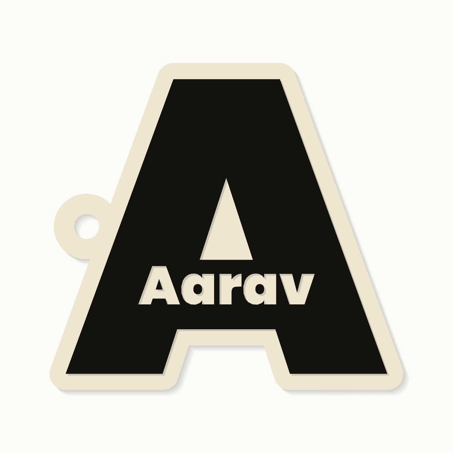Initial keychain with a name cut through it