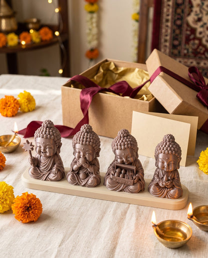 Diwali Buddhas — Set of Four — with a Diwali gift box and marigolds