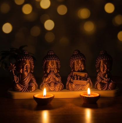 Diwali Buddhas — Set of Four — lit by diyas