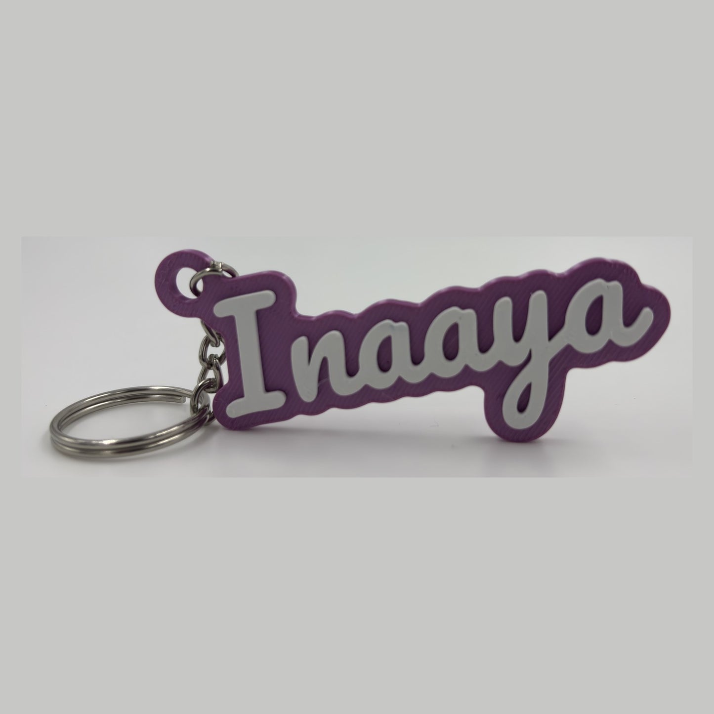 Cursive name keychain — photograph of the printed piece
