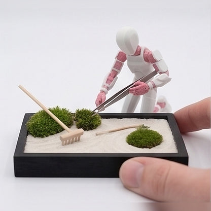Flexible figurine raking a miniature zen sand garden