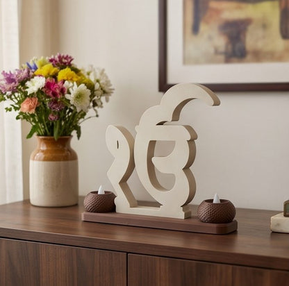 Ik Onkar Stand with Twin Diyas — on a living-room sideboard