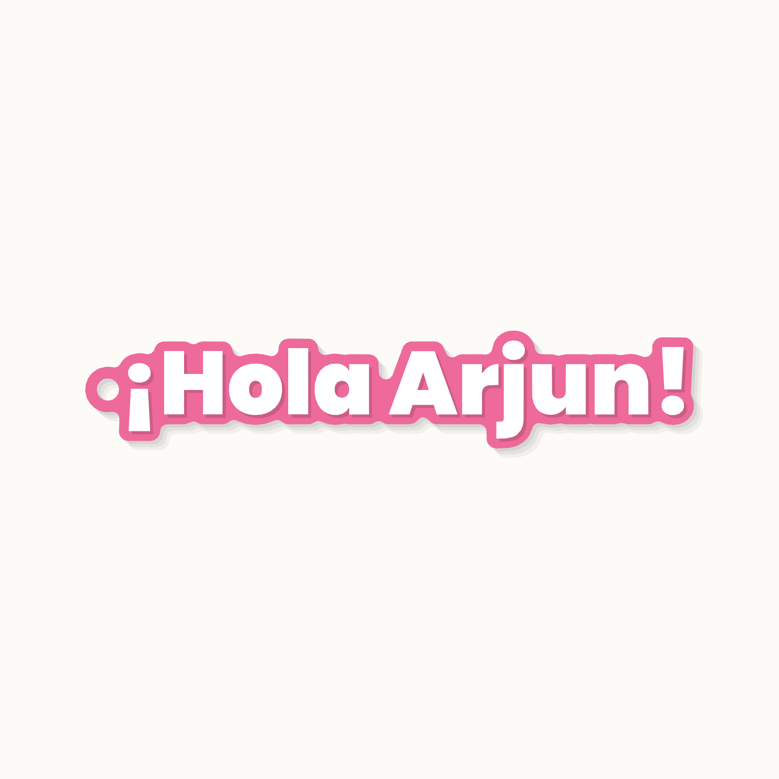 A keychain reading Hola Arjun in Spanish